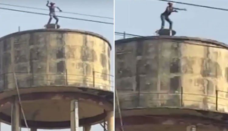 మద్యం సేవించి వాటర్‌ ట్యాంక్‌ పైకి ఎక్కి డ్యాన్స్‌ చేసిన వ్యక్తి