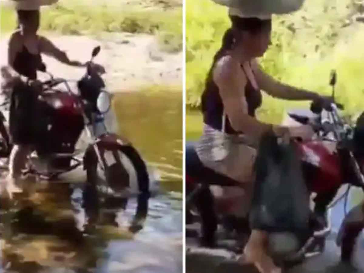 వండ‌ర్ వుమెన్ : త‌ల‌పై సామానుతో నీటిలో బైకుపై.. వీడియో వైర‌ల్‌