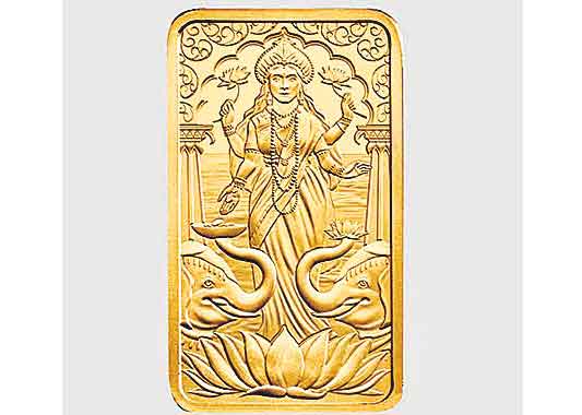 బ్రిటన్‌లో లక్ష్మీదేవత బొమ్మతో బంగారు బిస్కెట్‌