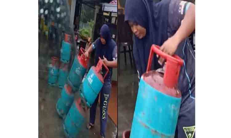 ఒకేసారి 4 సిలిండ‌ర్ల‌ను మోస్తూ.. కుటుంబ పోష‌ణ కోసం ఓ మ‌హిళ పాట్లు : వైర‌ల్ ఫోటో