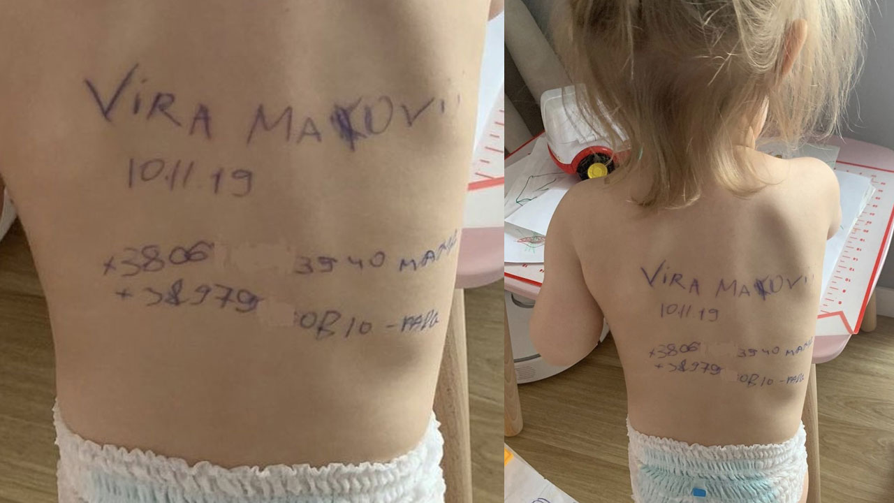 క‌లిచివేస్తున్న ఫోటో.. పిల్ల‌ల‌పై వివ‌రాలు రాస్తున్న ఉక్రెయిన్ త‌ల్లులు