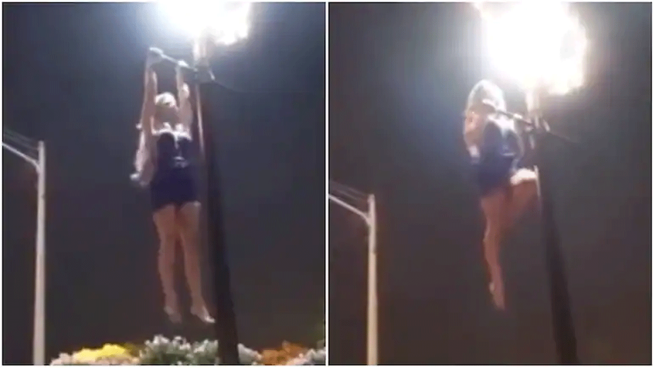 వైర‌ల్ వీడియో : క‌రెంట్ పోల్‌పై మ‌హిళ ఏరోబిక్స్‌