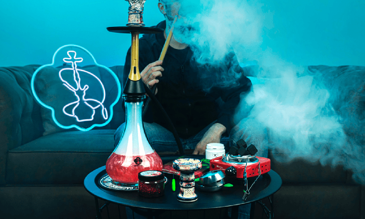 Smoking hookah | ఫాంహౌజ్‌లో హుక్కా తాగుతూ పట్టుబడిన యువకులు