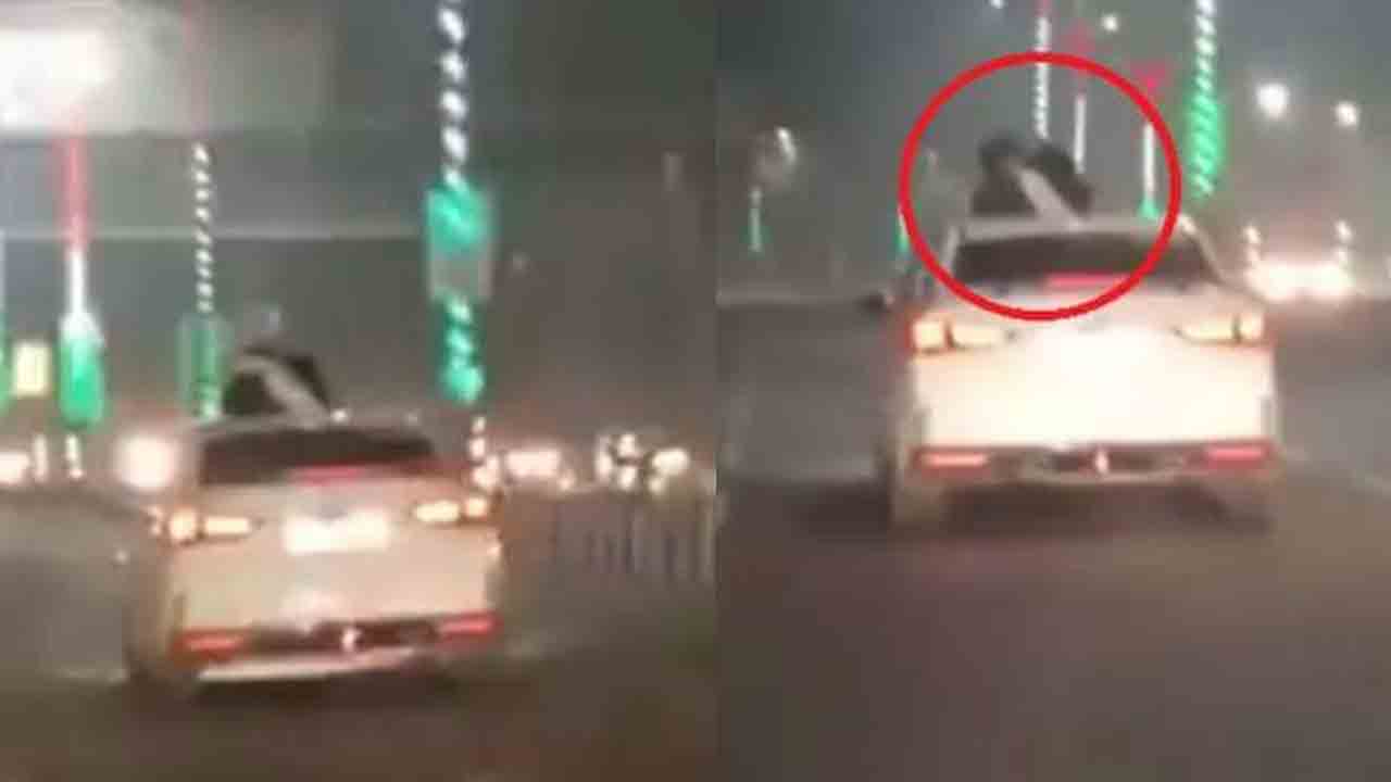 కదులుతున్న కారుపై ముద్దులు, హగ్గులతో రెచ్చిపోయిన జంట..!