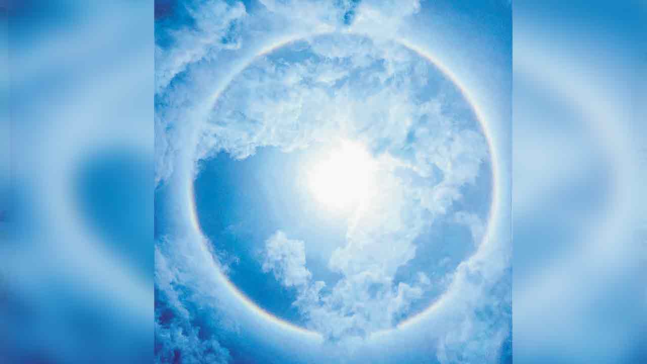 Sun Halo |  వినీలాకాశంలో అద్భుతం.. సూర్యుడి చుట్టూ సప్తవర్ణశోభితమైన హరివిల్లు