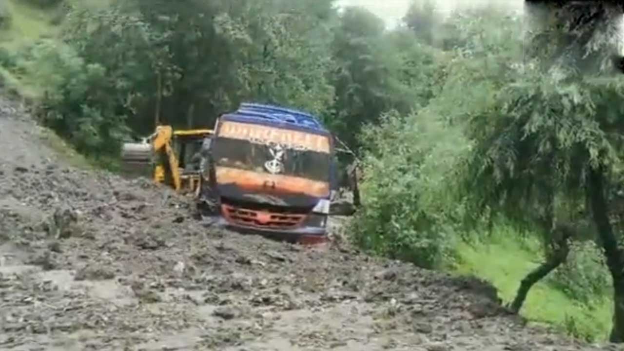 Mudslide | కొండ పైనుంచి జారి బస్సును ఢీకొట్టిన బురద.. ఇద్దరు దుర్మరణం.. Video