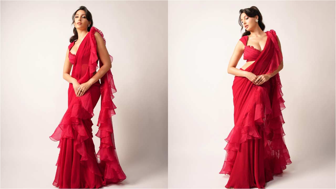 Nora Fatehi : రెడ్ సారీ లో అందాలతో రెచ్చగొడుతున్న నోరా ఫతేహి