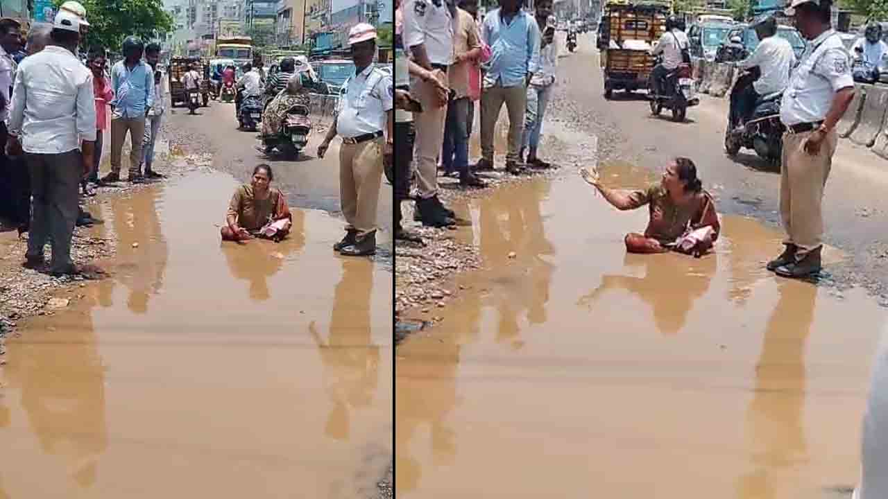 Viral Video | హైద‌రాబాద్ రోడ్లు గుంత‌ల‌మ‌యం.. వ‌ర‌ద నీటిలో కూర్చుని మ‌హిళ వినూత్న నిర‌స‌న‌