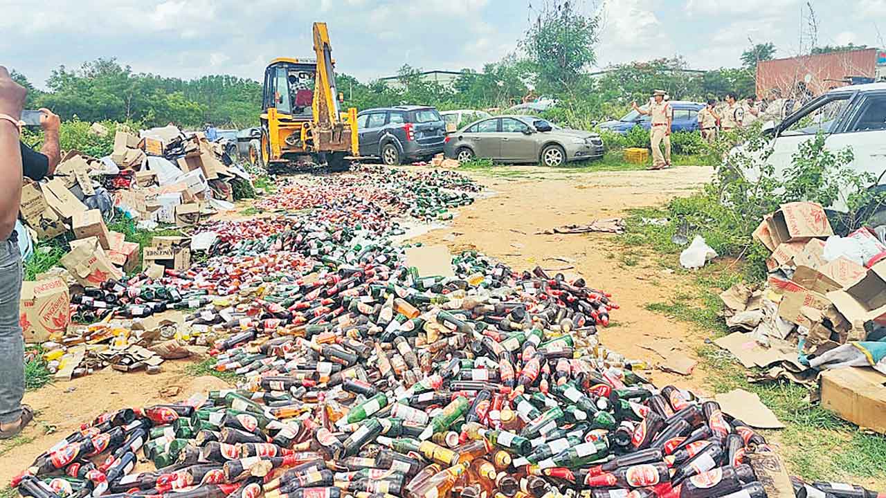 మద్యం సీసాల ధ్వంసం