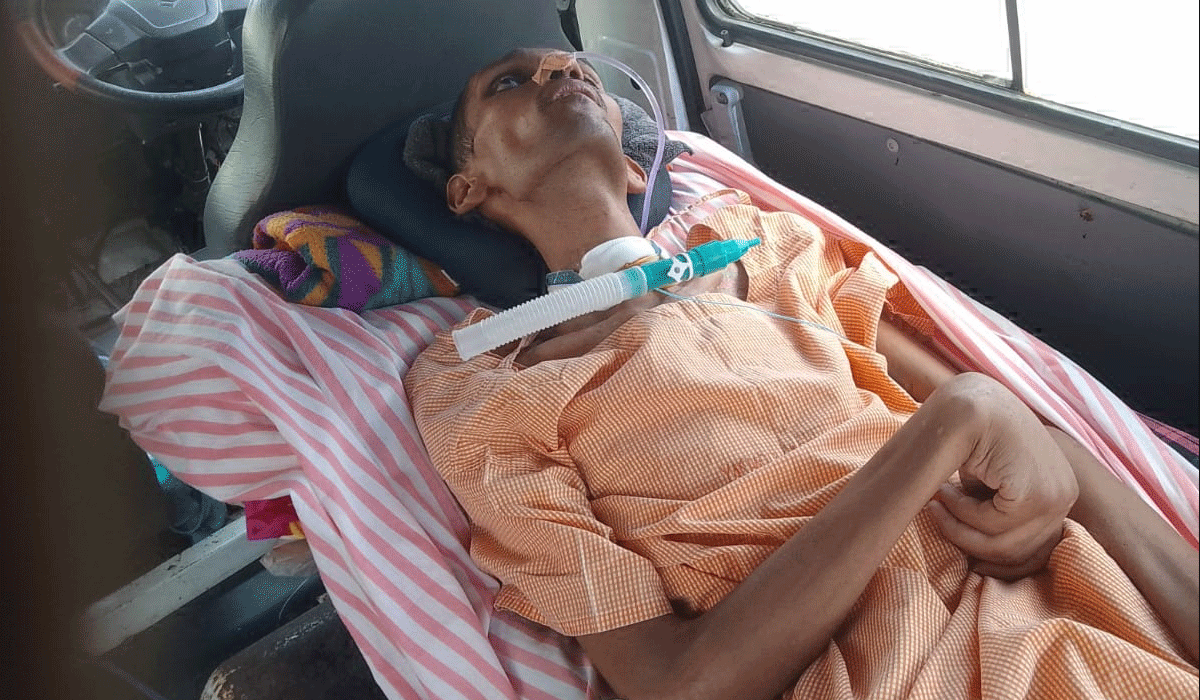 Demanding justice | మా కొడుకుకు న్యాయం చేయాలని.. అచేతన స్థితిలో ఉన్న యువకుడితో ధర్నాకు దిగిన తల్లిదండ్రులు