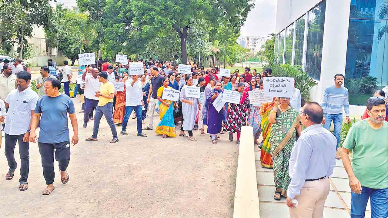 అనుమతులున్నా..మా గోడ కూల్చేశారు