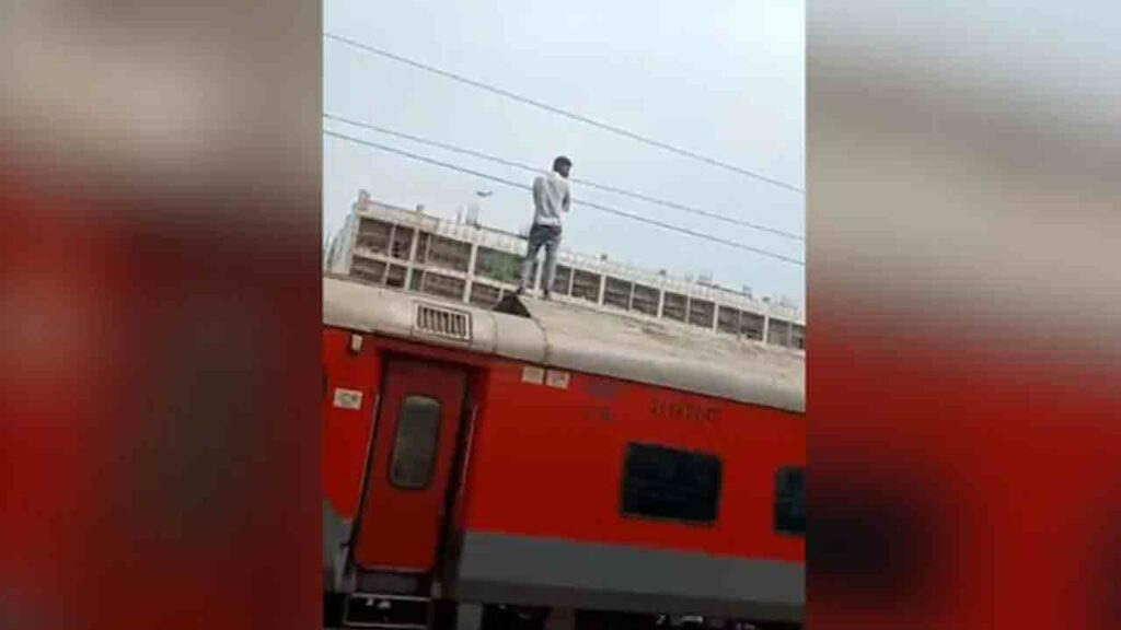 Man Stands On Top Of Train