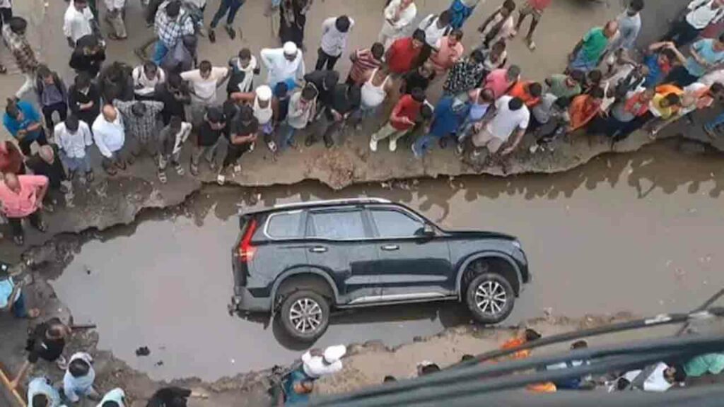 Suv Falls Into Pothole In B