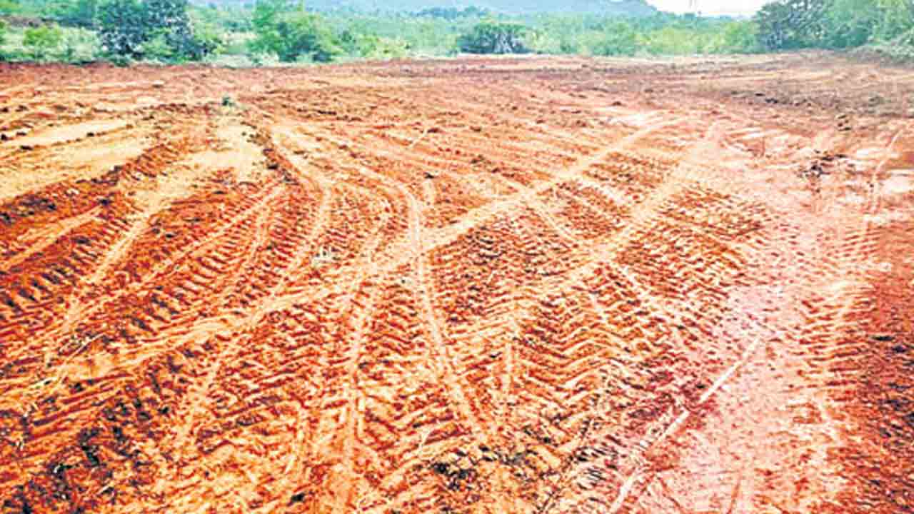 భూముల పందేరం