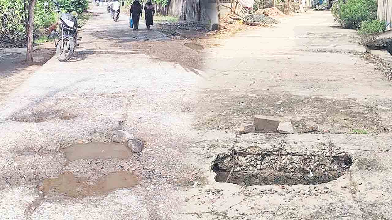 డ్రెయిన్‌ స్లాబ్‌కు బుంగ.. అవస్థలు పడుతున్న ప్రజలు, వాహనదారులు