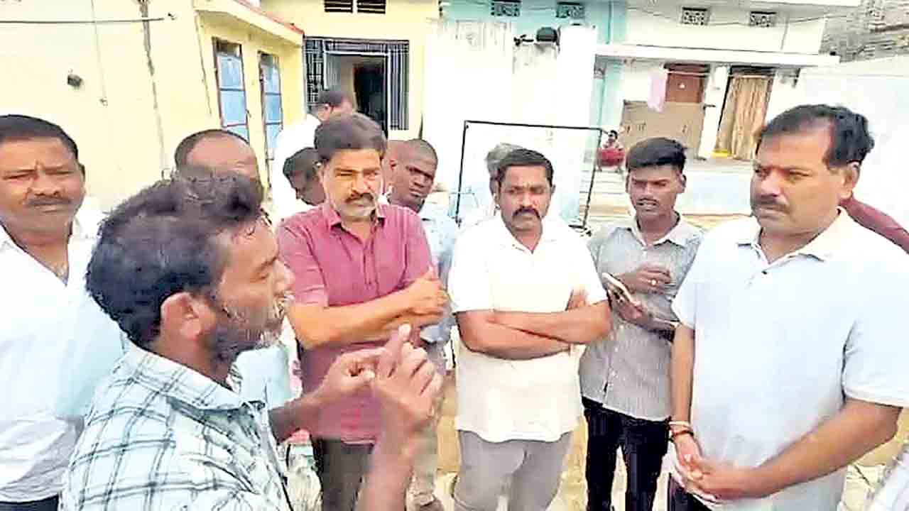 కలెక్టర్‌ కాళ్లపై పడిన నిరుపేద.. చితకబాదిన పోలీసులు