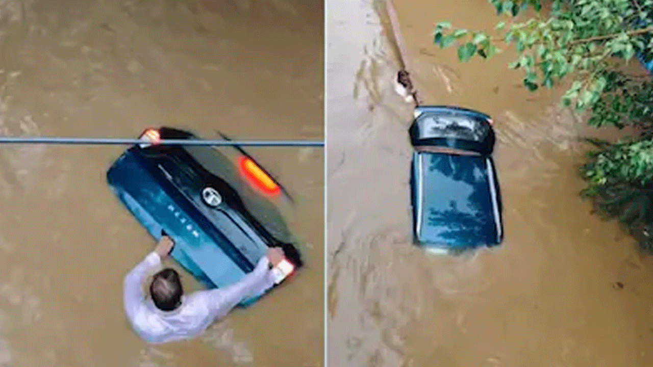 Viral news | వ‌ర‌ద‌లో కారు కొట్టుకుపోకుండా ప‌ట్టుకున్న య‌జ‌మాని.. ఛాతీలోతు నీళ్లలో జేసీబీ కోసం ఎదురుచూపు..!